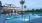 a swimming pool with palm trees
